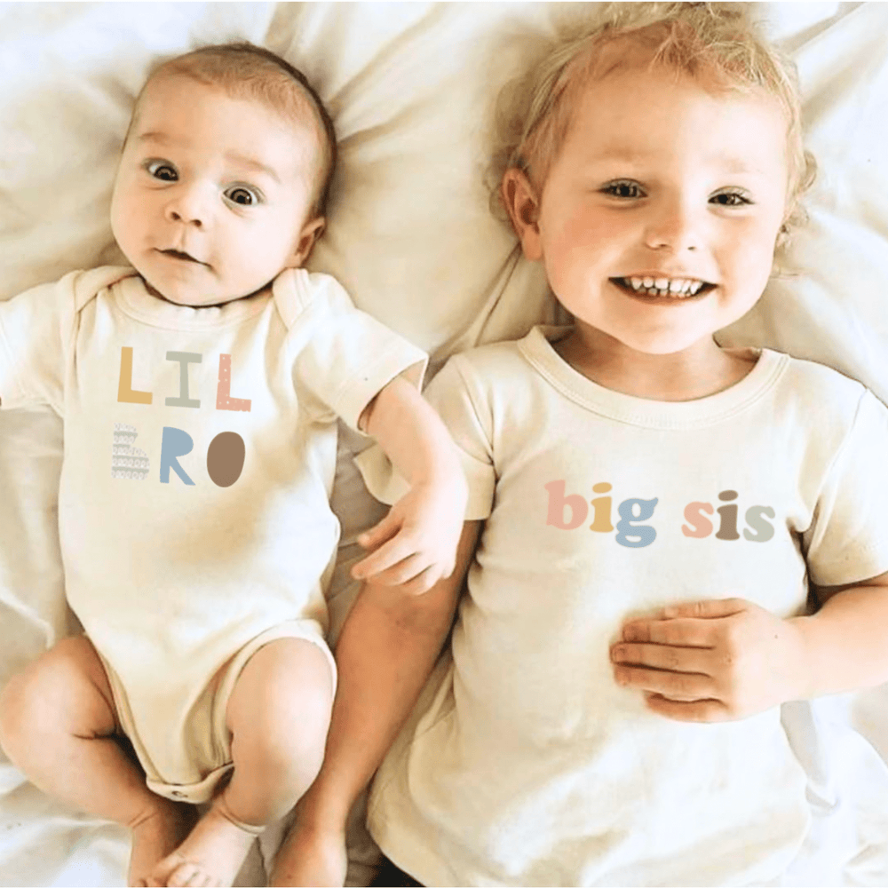 Graphic bodysuit for babies, "Lil Bro" in desert rose color, perfect for stylish short sleeve outfits.