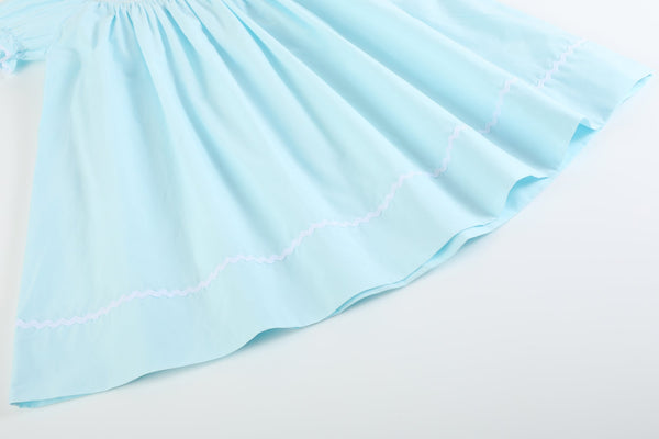 Light blue daisy smocked bishop dress for babies, angle 3 view showcasing delicate design and vibrant colors.