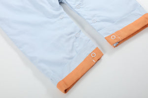 Light blue pumpkin applique overalls for babies, shown from angle 3, perfect for fall fashion.