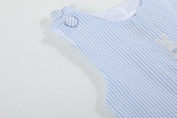 Light blue seersucker Easter bunny overalls for babies, stylish shortall at angle 5. Perfect for spring celebrations.