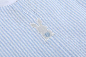 Light blue seersucker Easter bunny overalls for babies, shown from angle 3, perfect for spring celebrations.