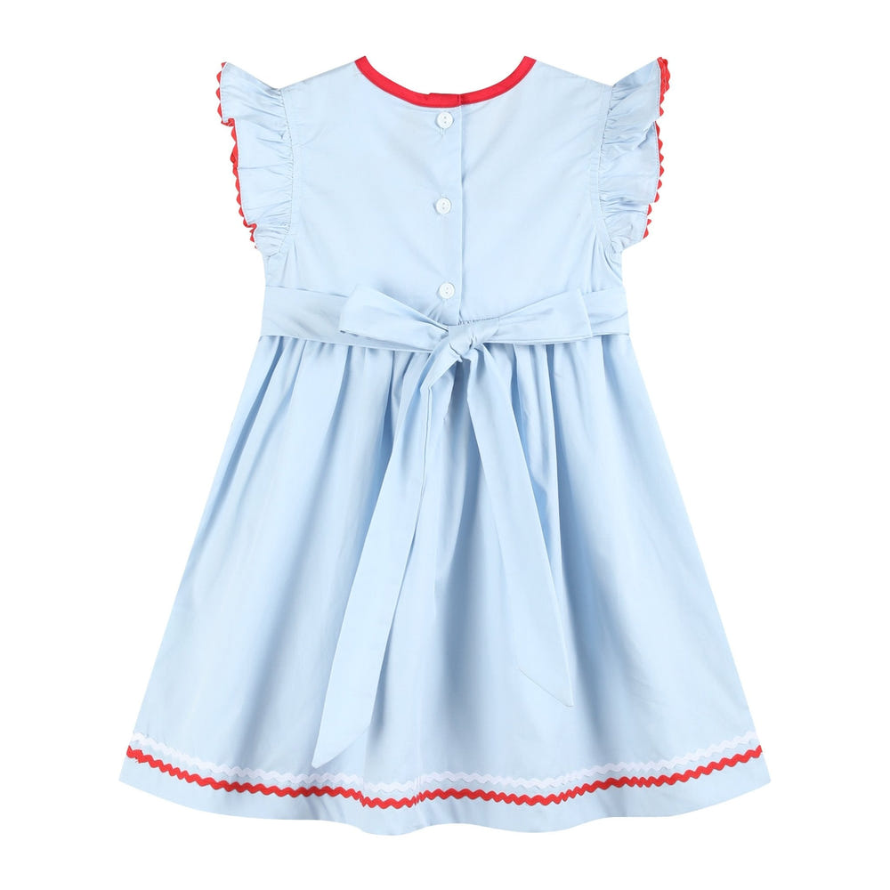 Light blue USA flag smocked dress for babies, perfect for patriotic occasions and summer outings.