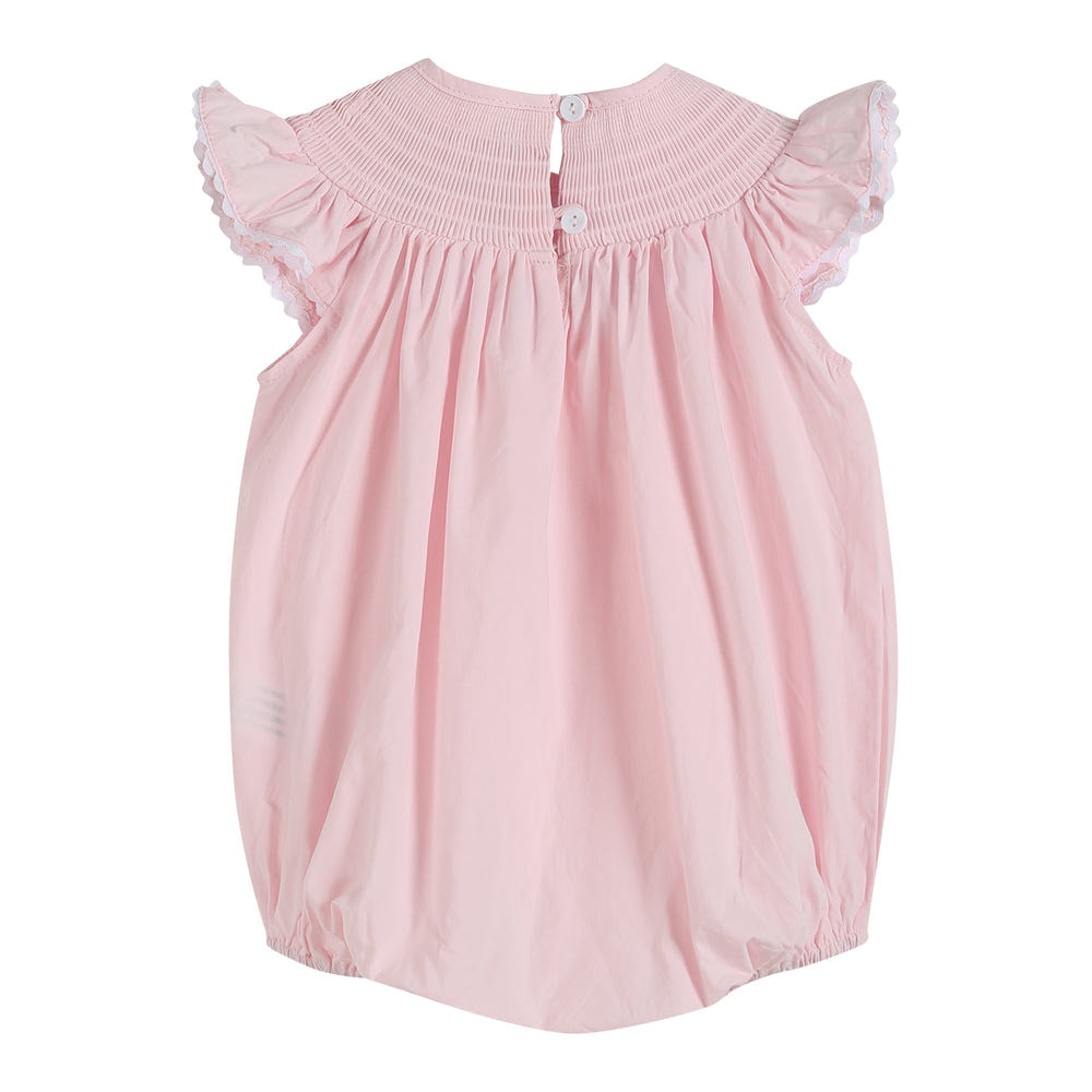 Light pink daisy smocked ruffle romper for babies, perfect for stylish summer outings.