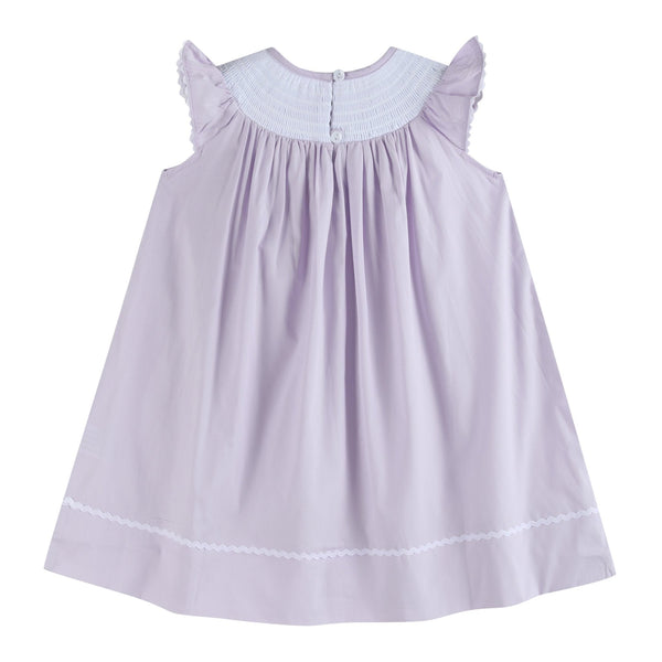 Light purple bunnies smocked bishop dress for babies, angle view showcasing cute design and details.