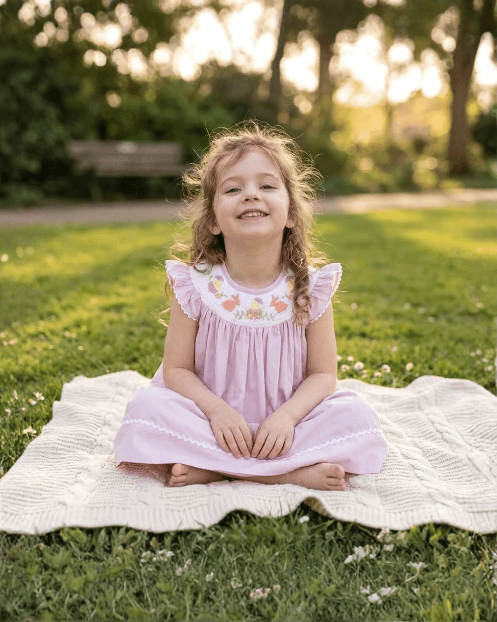 Light purple Easter smocked bishop dress for babies, perfect seasonal accessory for spring celebrations.