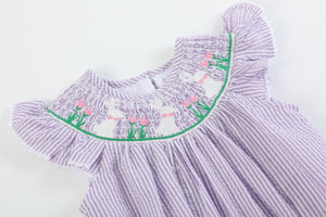 Light purple seersucker bunny smocked romper for babies, angle view 3, perfect for cute and comfy outfits.