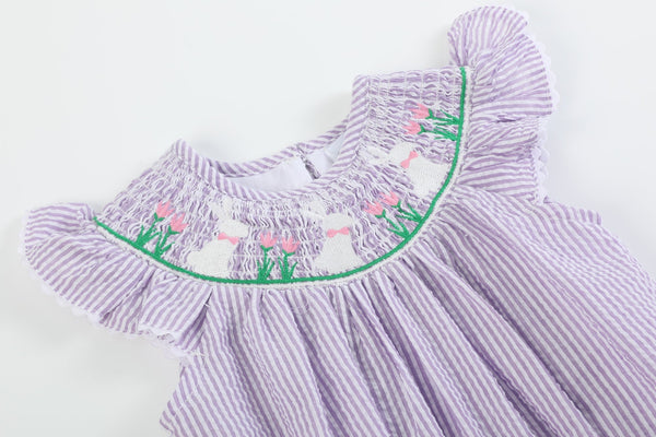 Light purple seersucker bunny smocked romper for babies, angle view 3, perfect for cute and comfy outfits.