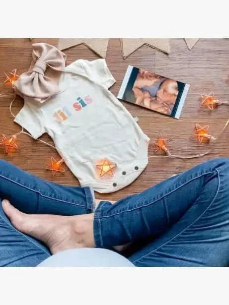 "Graphic bodysuit for baby girl 'lil sis' - short sleeve, cute design, perfect for stylish infants."