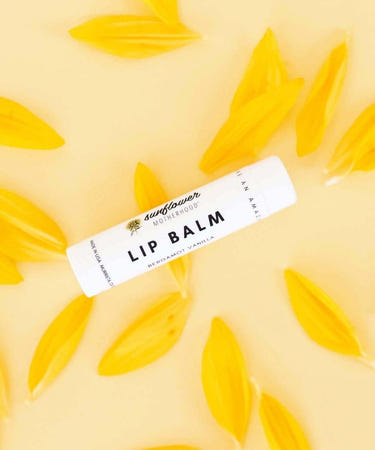 Natural baby lip balm in a cute container, perfect for softening and protecting delicate lips.