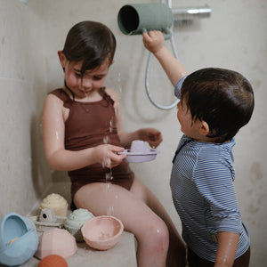 Colorful baby bath rinse cup at a 15-degree angle, perfect for gentle rinsing during bath time.