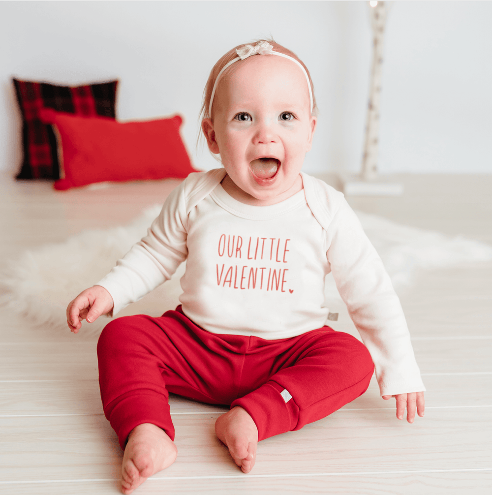 Long sleeve graphic bodysuit for babies by Little Valentine, perfect for stylish and comfortable everyday wear.
