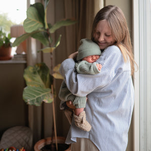 Baby chunky knit pants in a cozy design, angled view showcasing texture and style. Perfect for little ones!