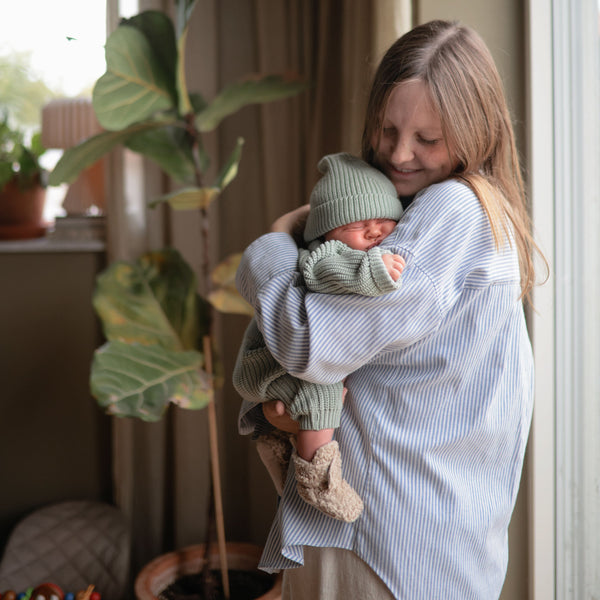 Baby chunky knit pants in a cozy design, angled view showcasing texture and style. Perfect for little ones!