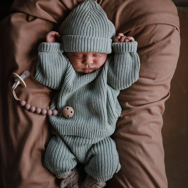 Chunky knit pants for babies, cozy and stylish, shown from angle 13. Perfect for comfort and warmth.