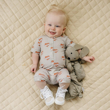 Mama Tattoo Hearts Bamboo Henley Romper for babies, stylish and comfortable clothing in soft bamboo fabric.