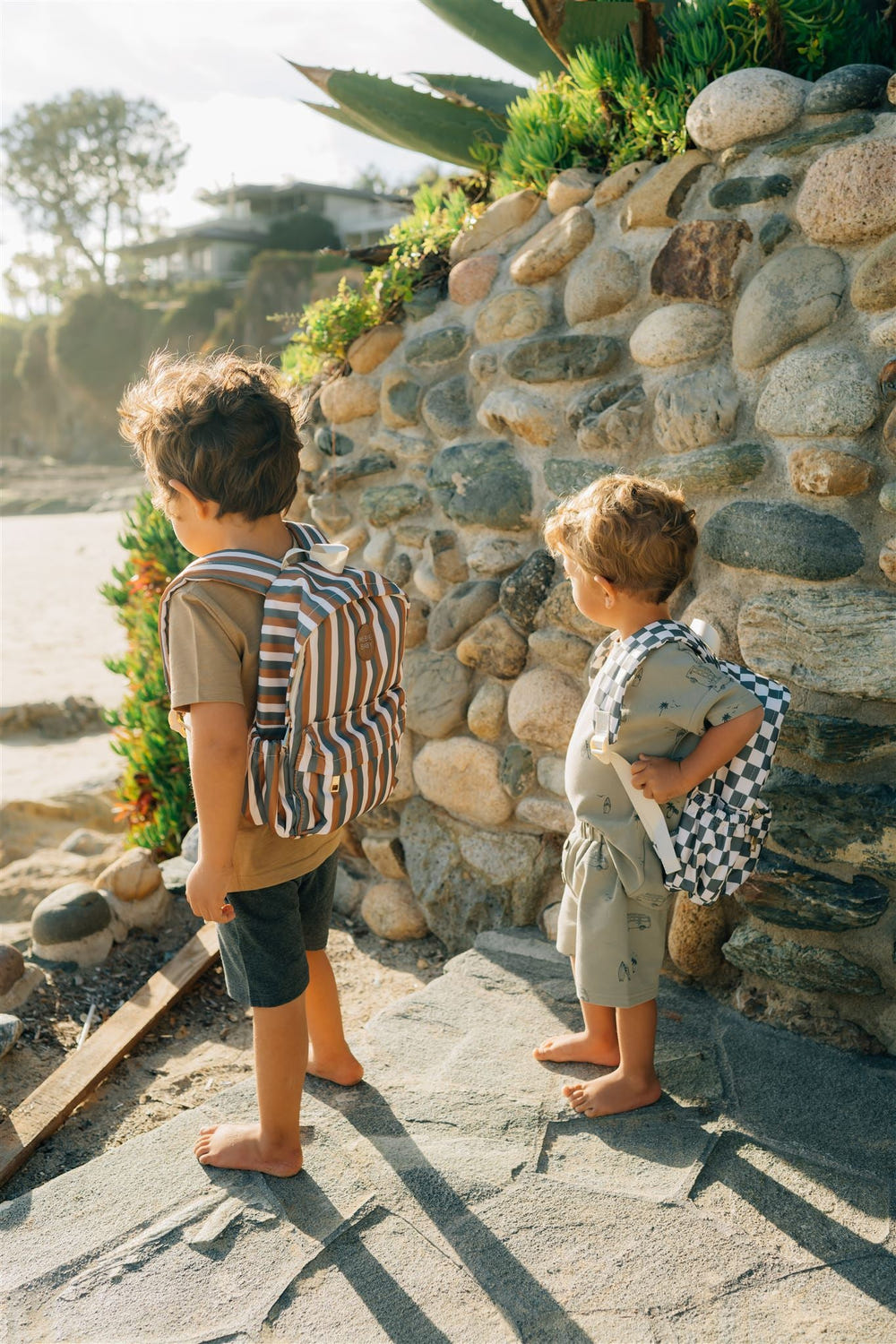 Green checkered mini backpack for babies, perfect accessory for outings and seasonal wear.