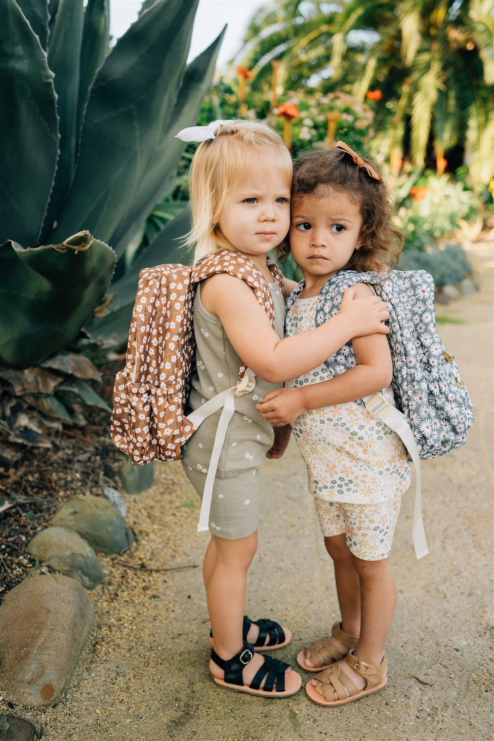 Mustard floral mini backpack for babies, perfect for gear and equipment on-the-go.