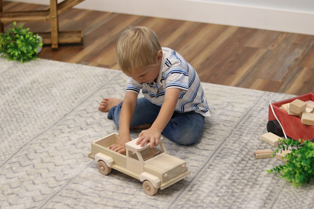 Amish-made wooden pickup truck toy with hitch, unfinished, perfect for imaginative play and farming fun.