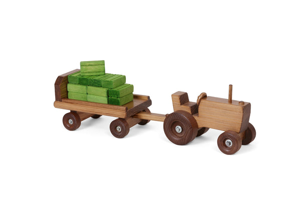Amish-made wooden toy tractor and wagon set with hay bales, showcasing craftsmanship and fun for kids.