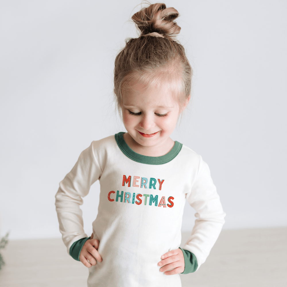 Green Merry Christmas pajamas for babies, perfect for festive holiday sleepwear.
