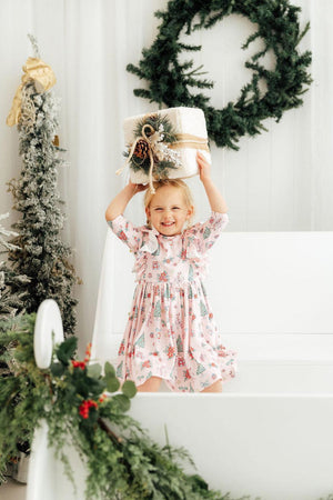 Pink Christmas 3/4 sleeve ruffle twirl dress for babies, angled view showcasing festive design and playful style.