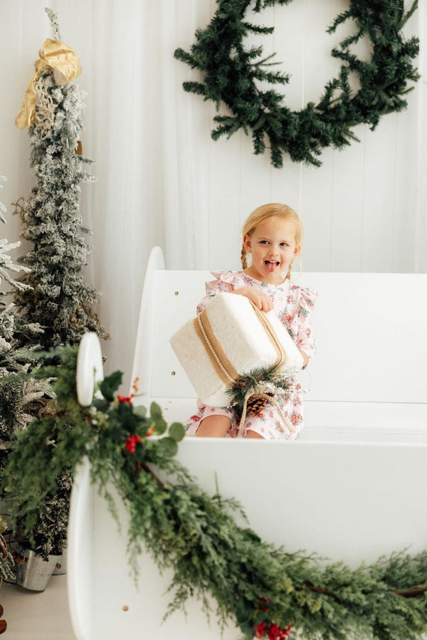 Pink Christmas 3/4 sleeve ruffle twirl dress for babies, angle view showcasing festive design and playful style.