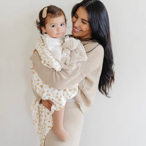 Soft Minky Stretch Receiving Blankets in various colors, perfect for swaddling and keeping your baby cozy.