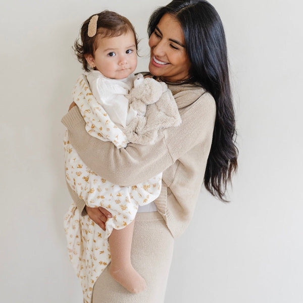 Soft Minky Stretch Receiving Blankets in various colors, perfect for swaddling and keeping your baby cozy.