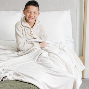 Soft Minky Stretch Receiving Blankets in various colors, perfect for swaddling and keeping your baby cozy.