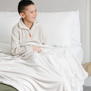 Minky stretch receiving blankets in soft colors, perfect for swaddling and keeping your baby cozy and comfortable.