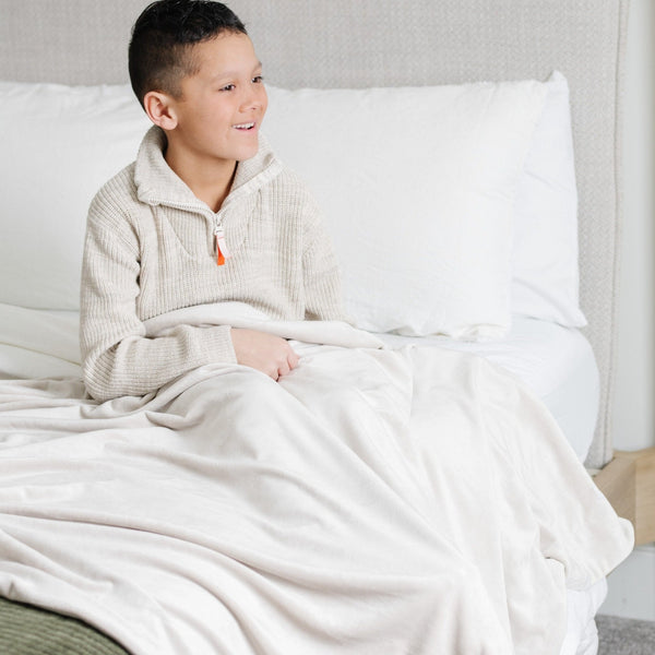 Minky stretch receiving blankets in soft colors, perfect for swaddling and keeping your baby cozy and comfortable.