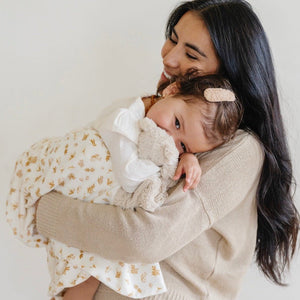 Soft Minky Stretch Receiving Blankets in various colors, perfect for swaddling and keeping your baby cozy.