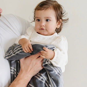 Minky stretch receiving blankets in soft colors, perfect for swaddling and keeping babies cozy. Angle 17 view.