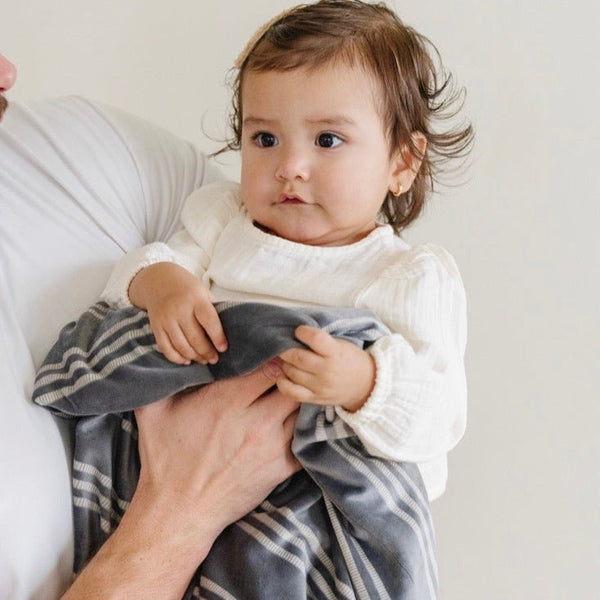 Minky stretch receiving blankets in soft colors, perfect for swaddling and keeping babies cozy. Angle 17 view.