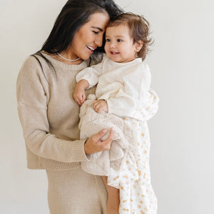 Soft Minky stretch receiving blankets in a cozy angle, perfect for swaddling and keeping your baby warm.
