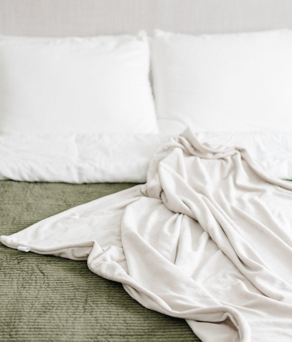 Minky stretch receiving blankets in soft colors, perfect for swaddling and keeping your baby cozy.