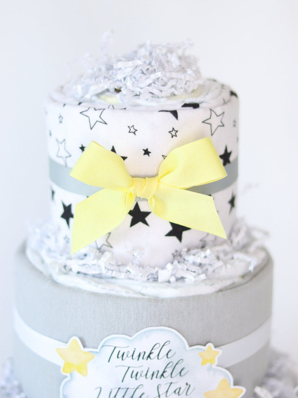 Moon Diaper Cake: Adorable baby shower gift made of diapers, decorated with moon and star accents.