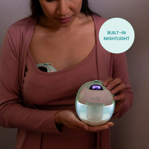 Motif Aura Glow Wearable Breast Pump in angle 6 view, showcasing its sleek design and portability for breastfeeding moms.