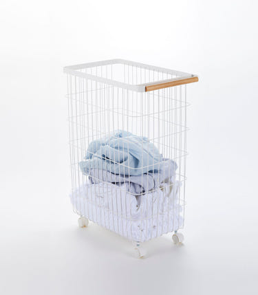 Rolling wire basket with wood accents, 24" H, perfect for laundry and storage solutions.