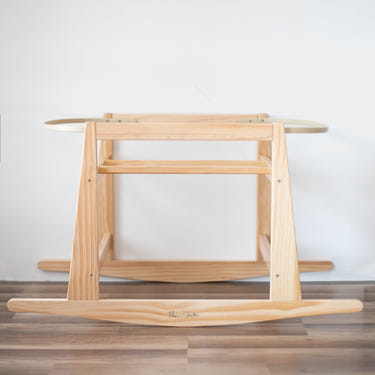 Original Rocking Moses Bassinet Stand with brake in natural wood finish, perfect for safe and stylish baby sleep.
