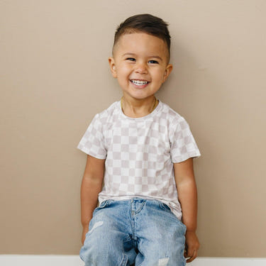 Neutral checkered bamboo tee for babies, available in sizes 3/6m and 6, perfect for stylish comfort.