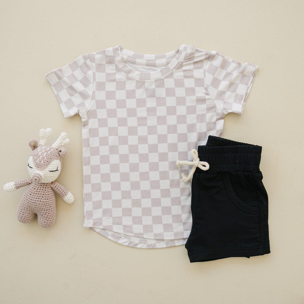 Neutral checkered bamboo tee for babies, available in sizes 3/6m and 6, perfect for stylish comfort.