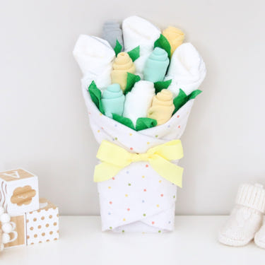 Neutral Dots Baby Gift Set: Adorable bouquet of baby essentials in soft colors, perfect for newborns and baby showers.