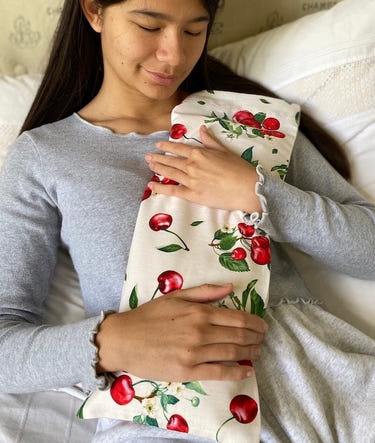 Hot Cherry cervical neck pillow in unbleached Natura Denim with cherry print pillowcase, perfect for baby comfort.
