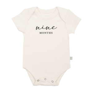 Charcoal graphic bodysuit for nine months milestone, short sleeve design for baby comfort and style.