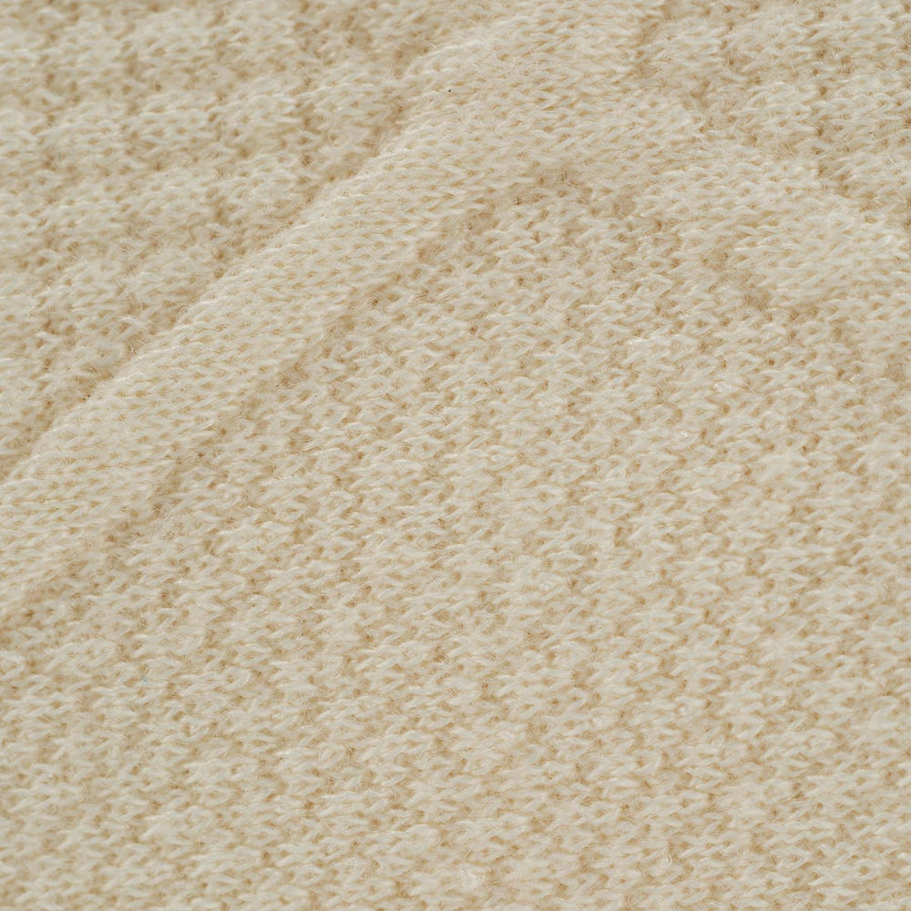 Soft oatmeal knit baby blanket, perfect for cozying up your little one.