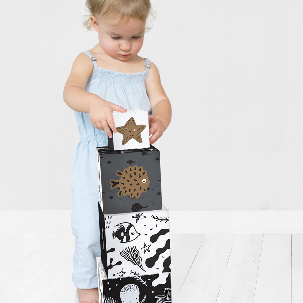 Colorful nesting blocks featuring ocean animals, perfect for baby's playtime and development.