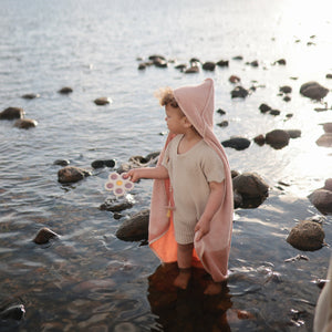 Colorful flower press toy for babies, encouraging creativity and sensory play at angle 13.