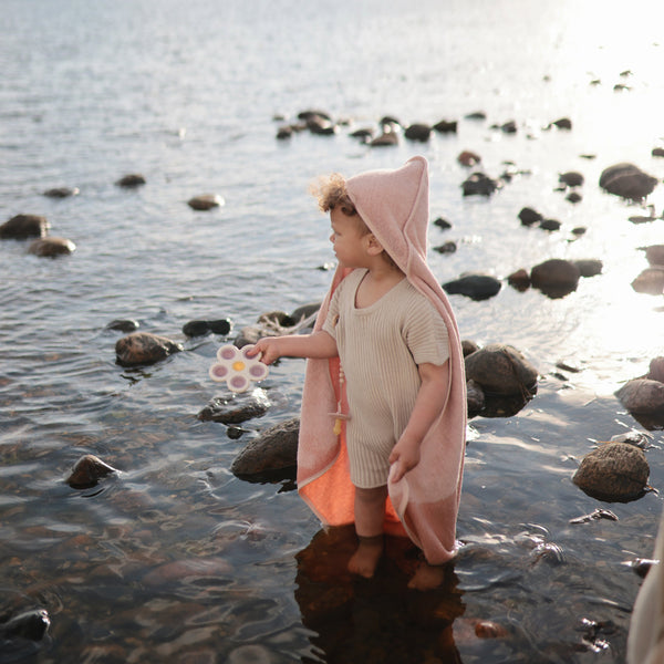 Colorful flower press toy for babies, encouraging creativity and sensory play at angle 13.