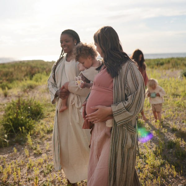 Colorful flower press toy for babies, promoting sensory play and creativity at an angle view.